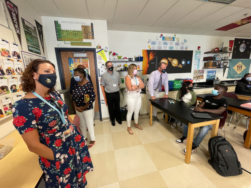 Visiting students on the first day of school are (l-r) Alison Myers, Janet Maull-Martin, Bill Collick, Jason Bradley, Jessica Tyndall and Superintendent Bob Fulton with students Angely Ramirez-Rodriguez and Trey Johnson. SUBMITTED PHOTO